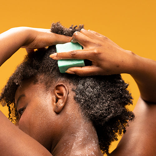What is co-washing and why does it work so well for curly hair?